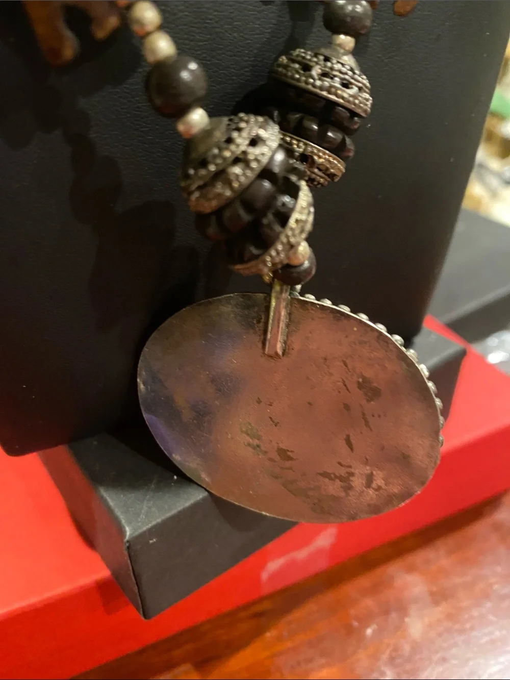 Handcrafted Elephant Pendant Necklace - Brown. Small elephants are bone.